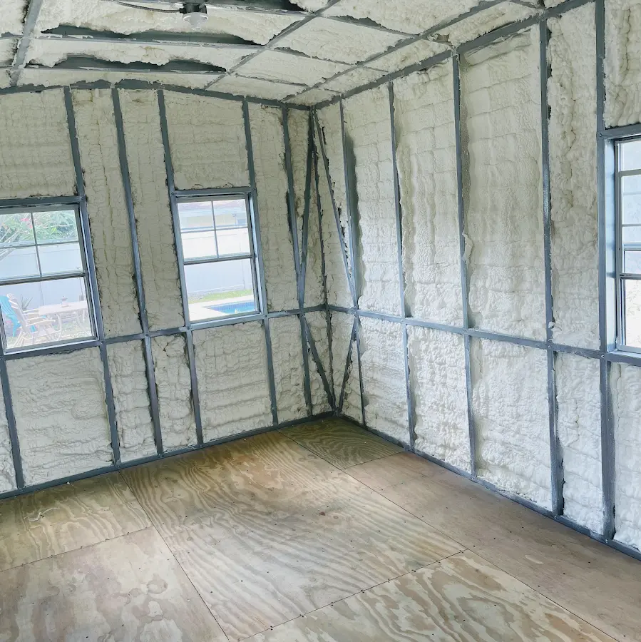 Closed-cell spray foam insulation applied to wall cavities in a residential project in Ecorse